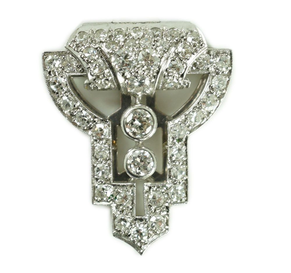 A 1930's Art Deco white gold and diamond cluster openwork clip brooch
